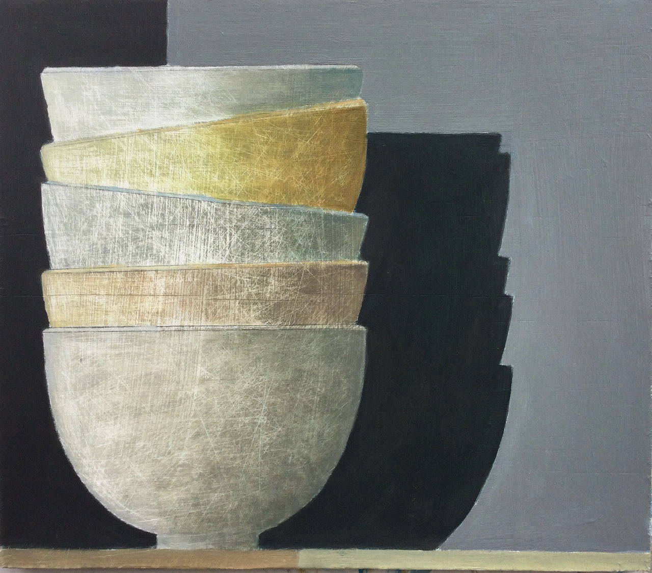 Stack of 5 muted colour bowls with grey wall behind, casting shadow by artist Philip Lyons