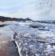 Sea of grey and blue tones lapping onto the sand with peninsula in the background by artist Jill Hudson