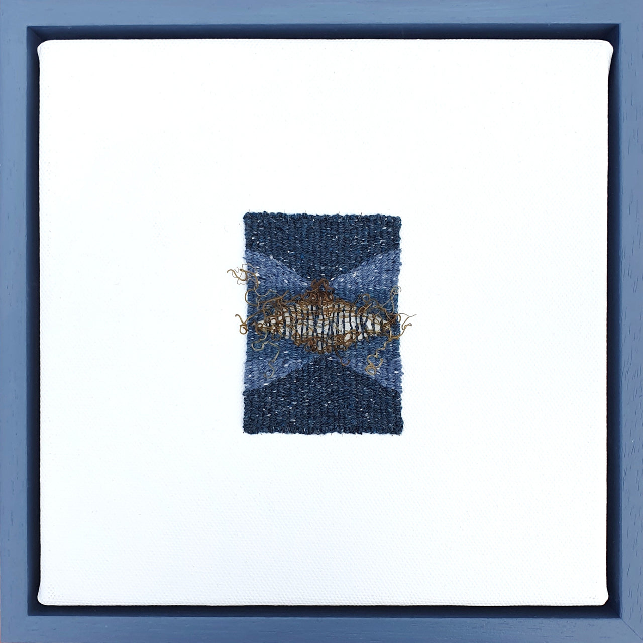 Tones of blue and ochre woven textile piece by artist Jess Rippengale