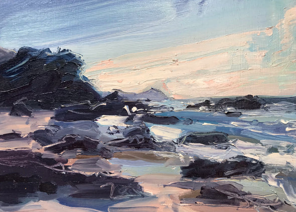 Pink tones of sand amongst the dark rocks and headland and ocean in the background by artist Jill Hudson
