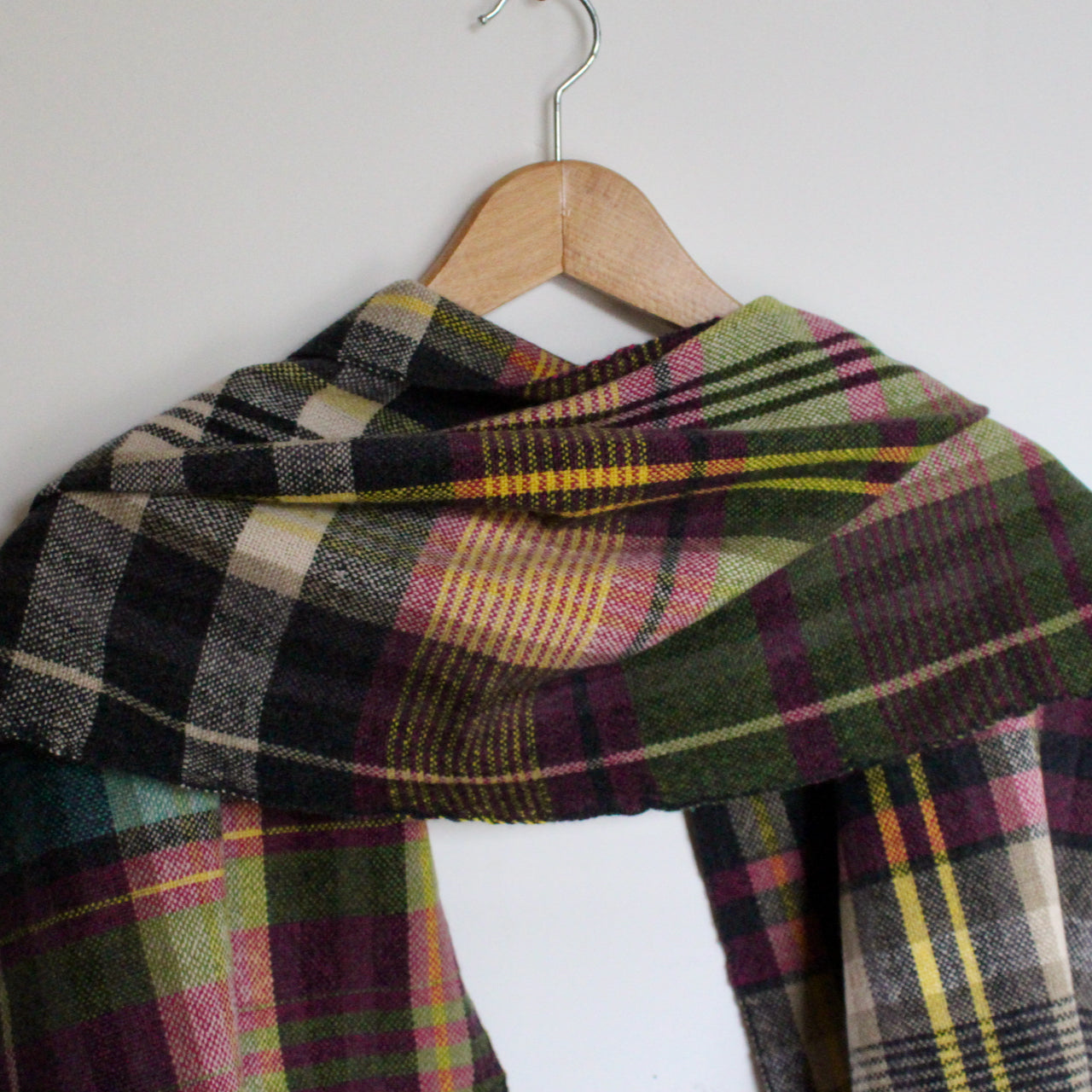 handwoven woollen scarf by Teresa Dunne Cornish textile artist in pink, green, purple and black 