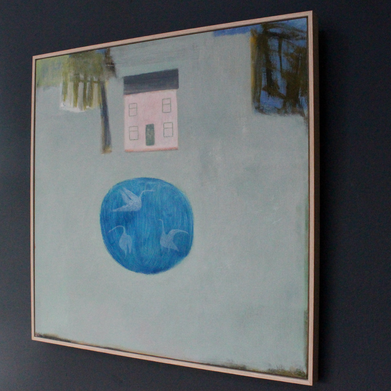 Pale pink house with blue pond and abstract trees by Cornish artist Heath Hearn.