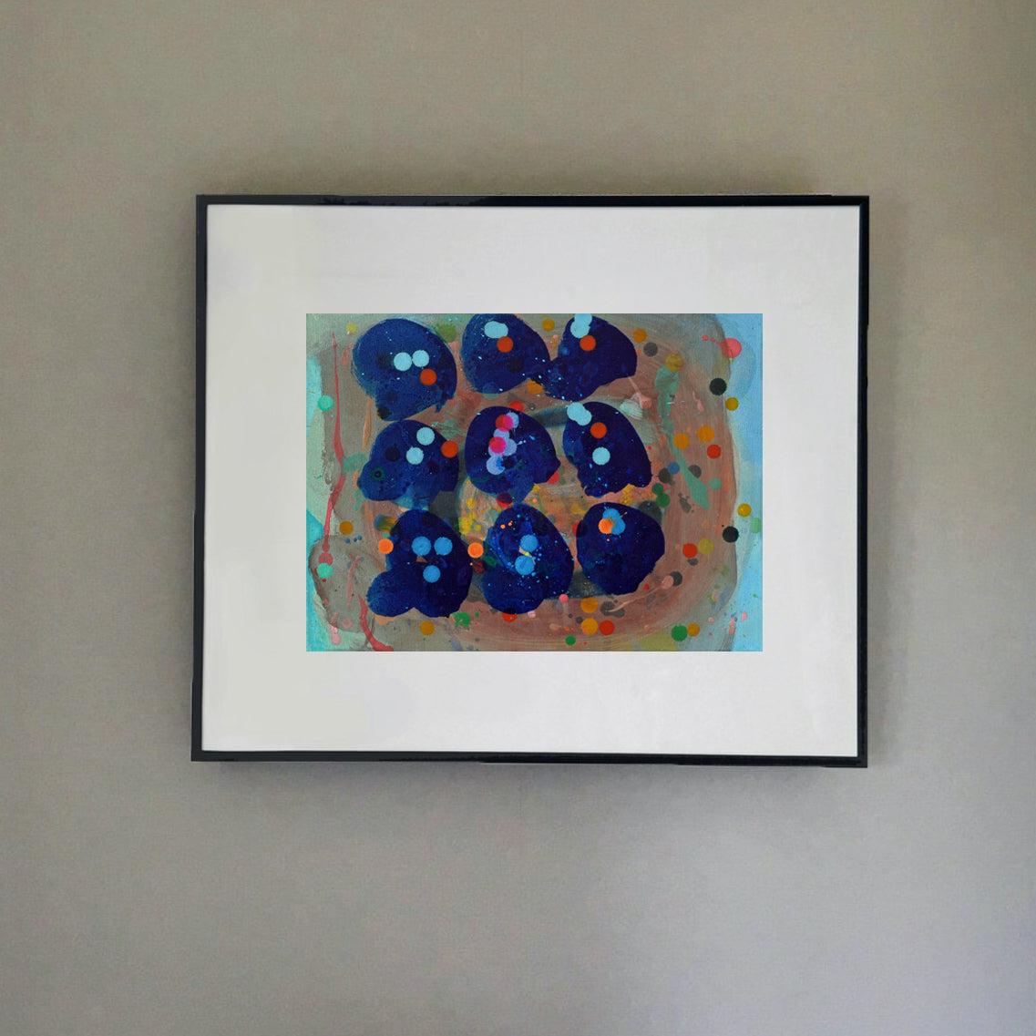 Nine blue shells on an ochre background with coloured spots of blues, reds and oranges by Ella Carty