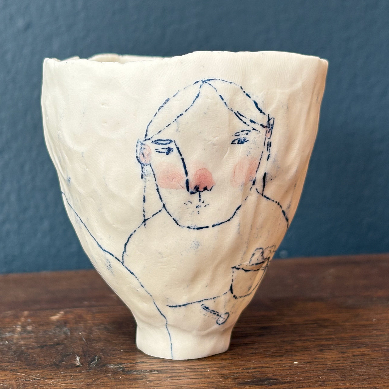 Becca Brown ceramic pot decorated with line drawing of girl eating a bowl of soup