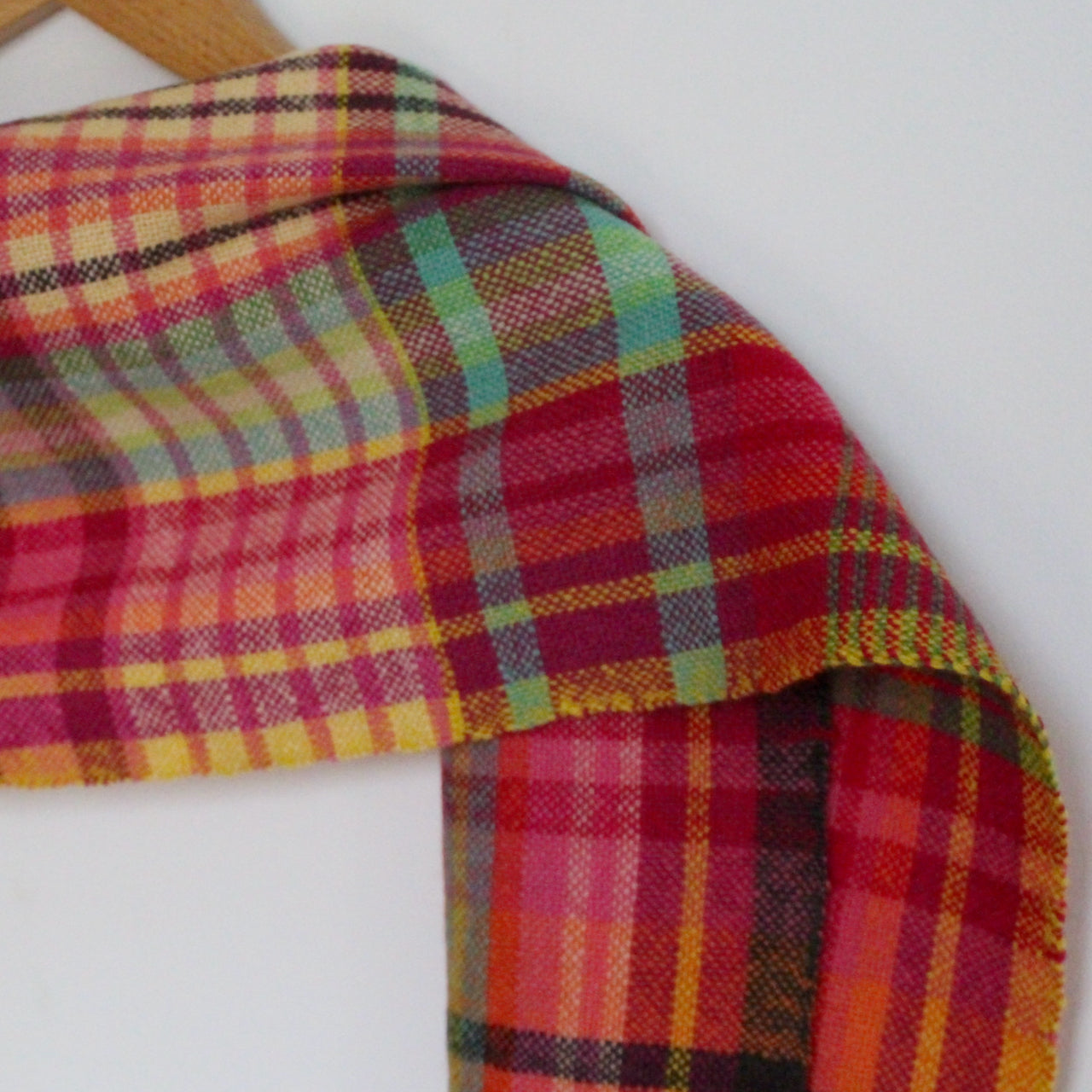 handwoven woollen scarf by Teresa Dunne Cornish weaver in red, green, orange and yellow