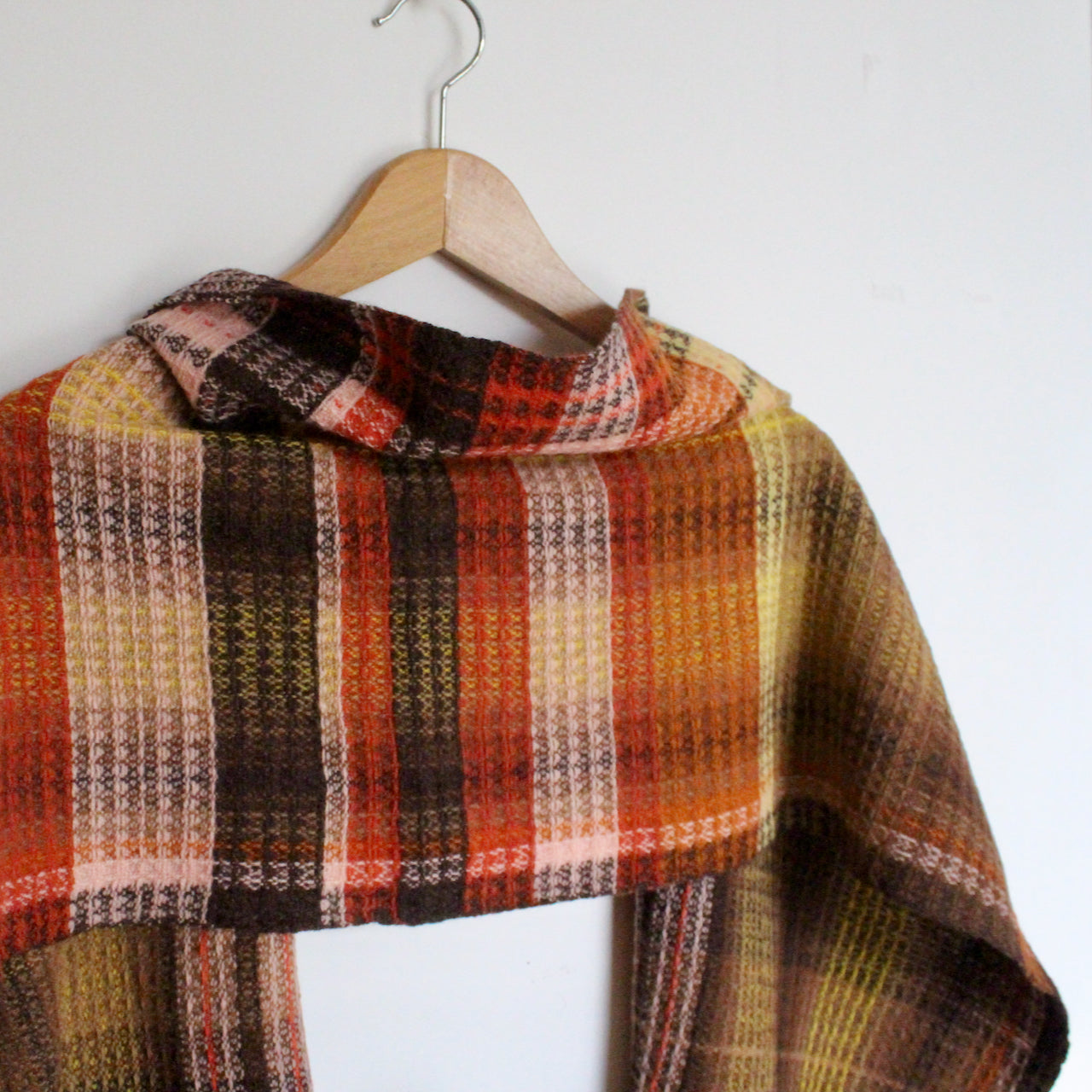 handwoven woollen scarf by Teresa Dunne Cornish weaver in pink, cream, brown and orange