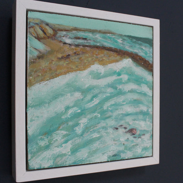 Framed painting of a figure swimming in the turquoise sea with beach and cliffs in the background by Cornish artist Siobhan Purdy.