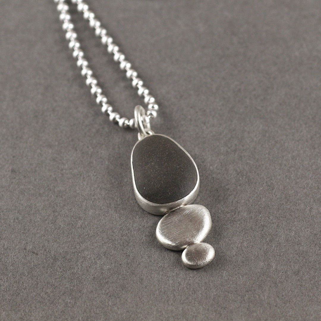 Beach pebble and silver pebble pendant by Carin Lindberg