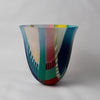 tall and gently curved multi-coloured glass vase  it is made by Ruth Shelley 