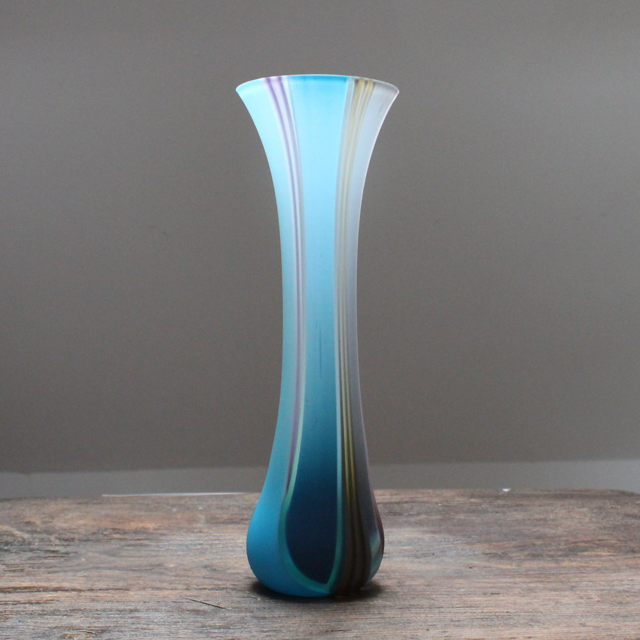 slim and slightly flared multi-coloured glass vase by glass artist Ruth Shelley