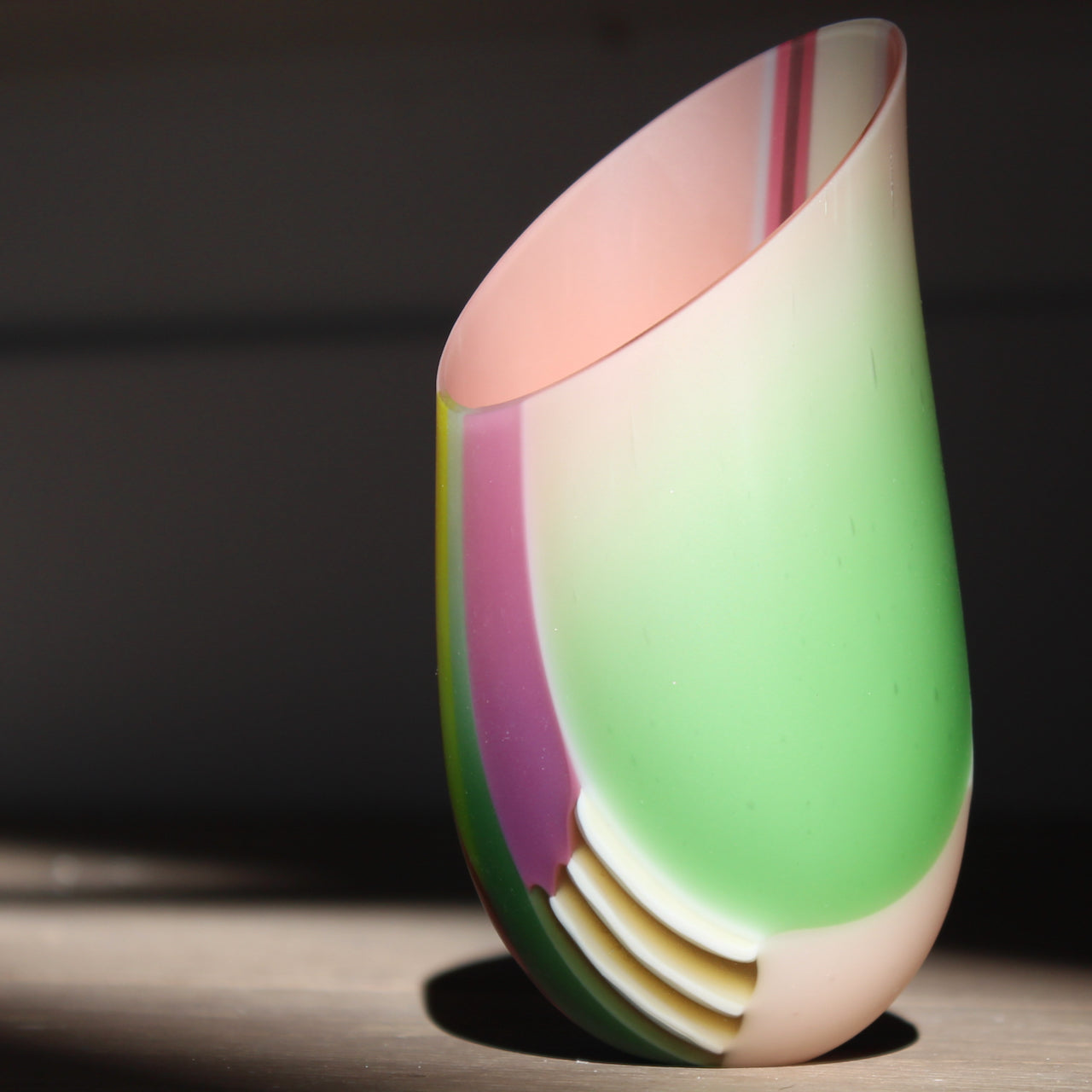 Ruth Shelley small glass vase in pink, mauve and pale green stripes with an angled rim 