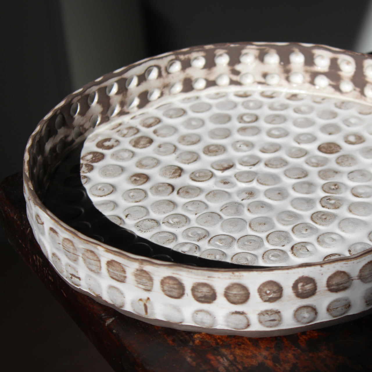 interior of white and brown textured platter by UK ceramicist Elly Wall.
