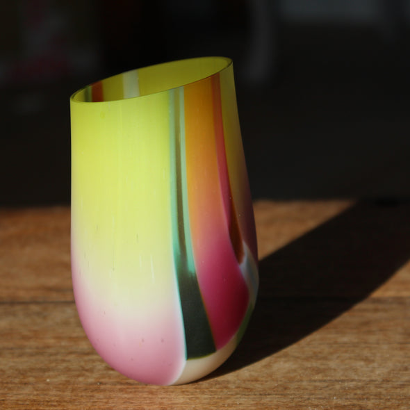 a small glass vase in yellow, pinks and greens by UK glass artist Ruth Shelley