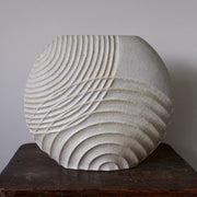 Michele Bianco pale white stoneware ceramic disc shaped vessel with carved overlapping lines. 