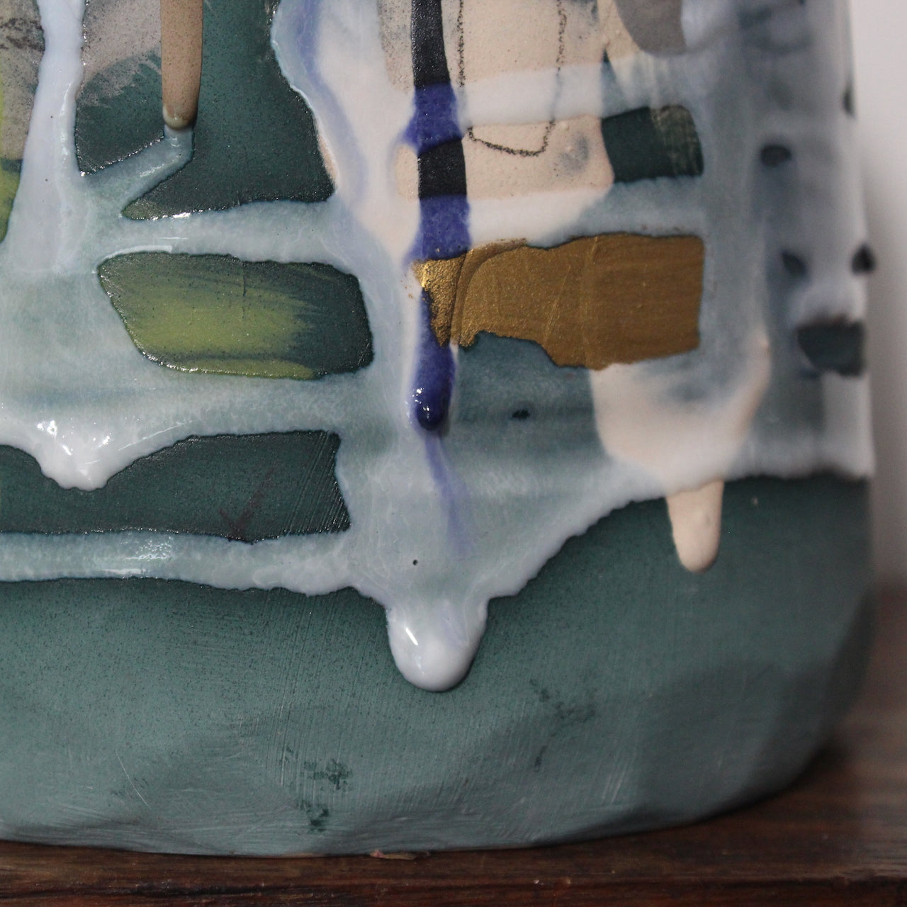 close up detail of a green and blue ceramic bottle by Dawn Hajittofi, ceramicist from the UK