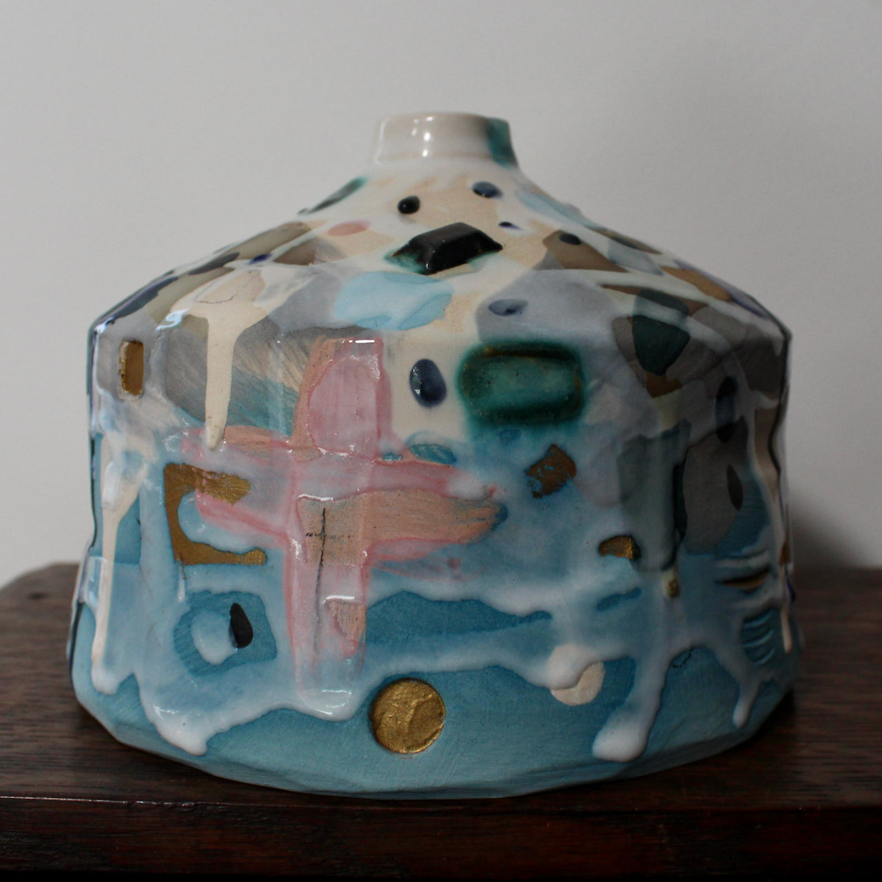 squat pink and blue ceramic bottle by ceramicist Dawn Hajittofi