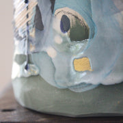 detail of a green and blue ceramic bottle  by Uk ceramicist Dawn Hajittofi