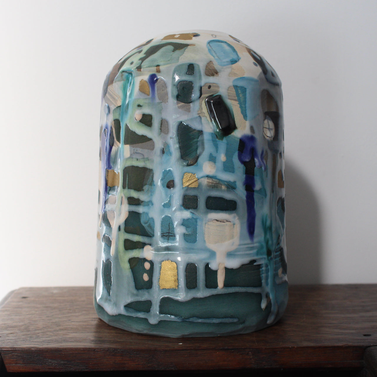 textured pale blue and turquoise ceramic bottle by Dawn Hajittofi, ceramicist .