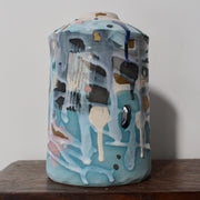 textured pale blue and pink ceramic bottle by Dawn Hajittofi, ceramicist 
