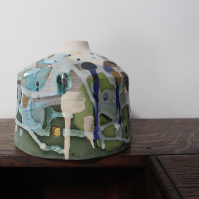 short ceramic bottle in blue, green and white by Uk ceramicist Dawn Hajittofi