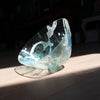 tilted and irregular shaped glass vessel in clear, blue and white glass by Cornish glass artist Helen Eastham.