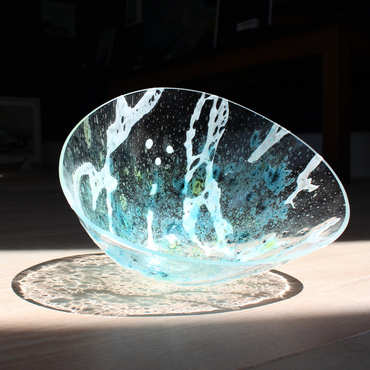 irregular shaped glass vessel in clear, blue and white glass by Cornish glass artist Helen Eastham 