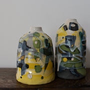 pair of ceramic bottles in yellow, green and blue by Uk ceramicist Dawn Hajittofi