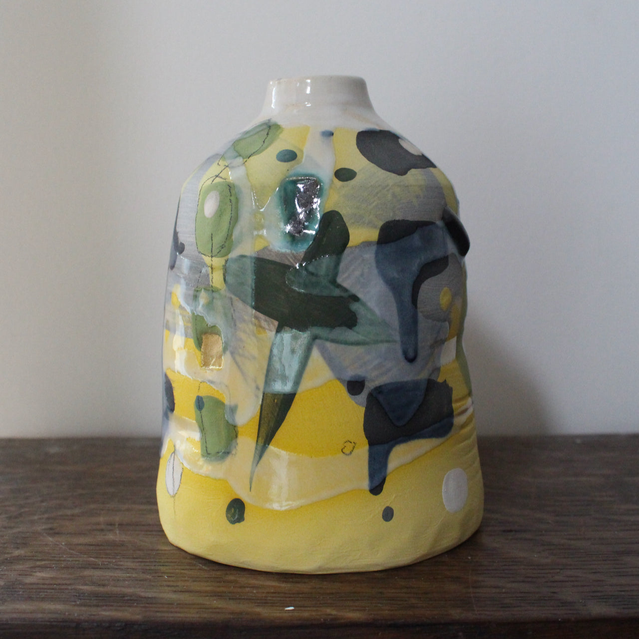 ceramic bottle in yellow, green and blue by Uk ceramicist Dawn Hajittofi