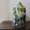 ceramic bottle in blue, green and yellow by Uk ceramicist Dawn Hajittofi