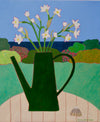painting by Sophie Harding of a green watering can with small white flowers in it sitting on a garden table with plants and the sea in the background 