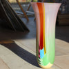 tall Ruth Shelley glass vessel in pale green and pink with a central red and yellow panel