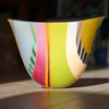 UK glass artist Ruth Shelley oval shaped glass bowl in green, pink, cream and pale blue stripes. 