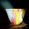 oval shaped glass bowl in green, pink, and pale blue stripes by UK glass artist Ruth Shelley