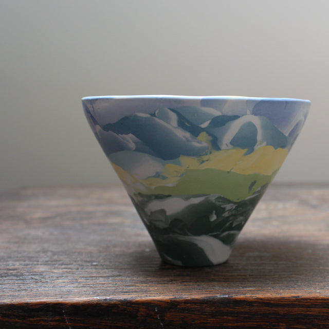 small ceramic bowl in blue, yellow and green by Judy Mckenzie