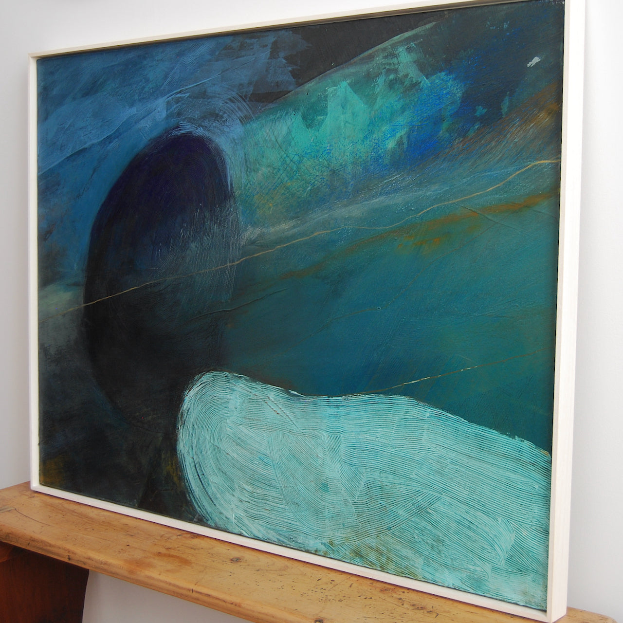 Alice Robinson-Carter abstract painting called Freathy which depicts a dark blue sky with a paler sea the painting has a white frame