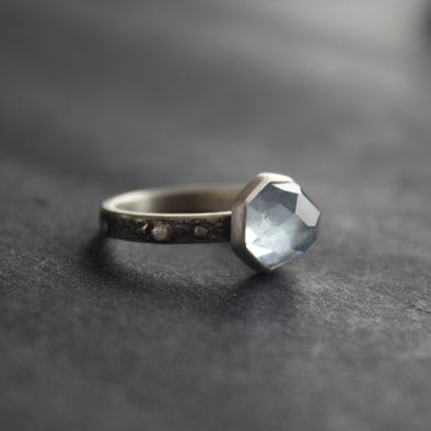 Textured silver ring with pale blue stone