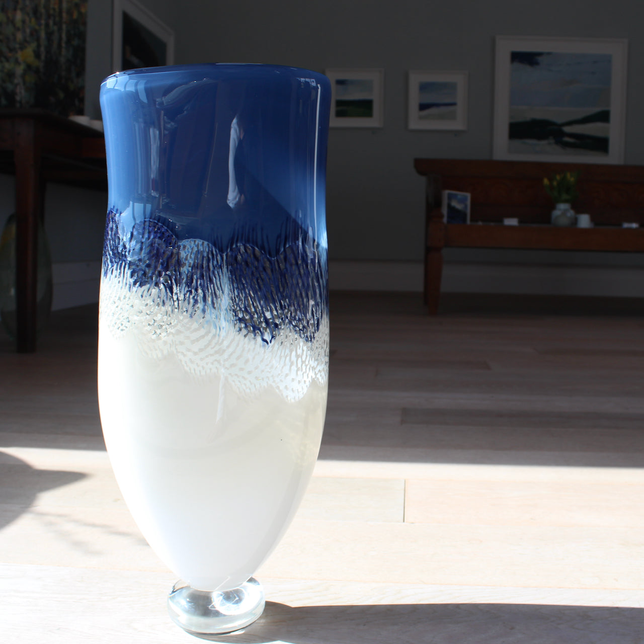 a all blue and white glass vessel in the sunshine by glass artist Benjamin Lintell 