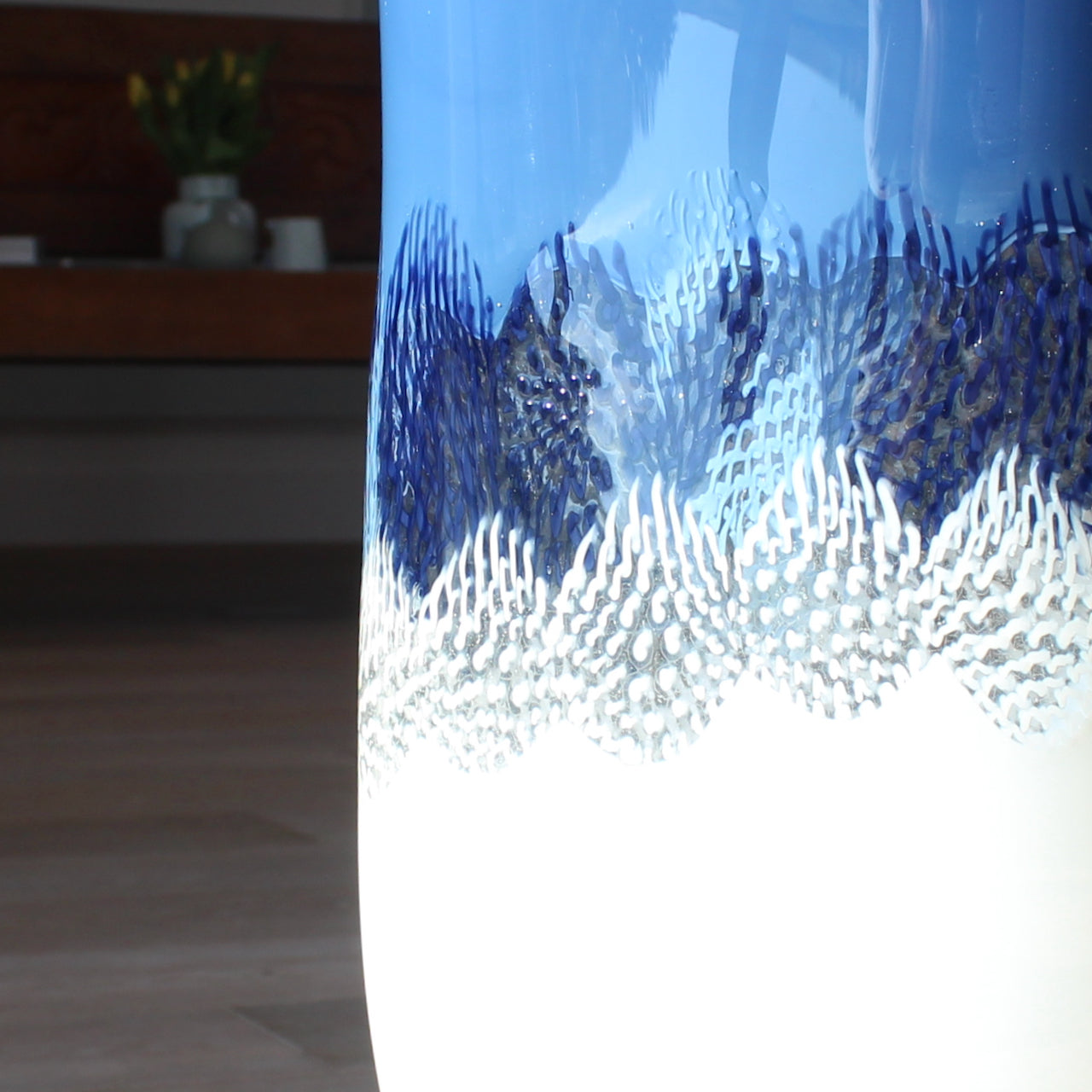 close up of a detail in a blue and white glass vessel by glass artist Benjamin Lintell 