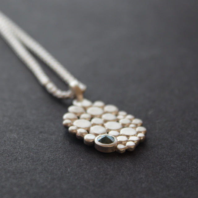 Multi pebble pendant with blue diamond by Carin Lindberg