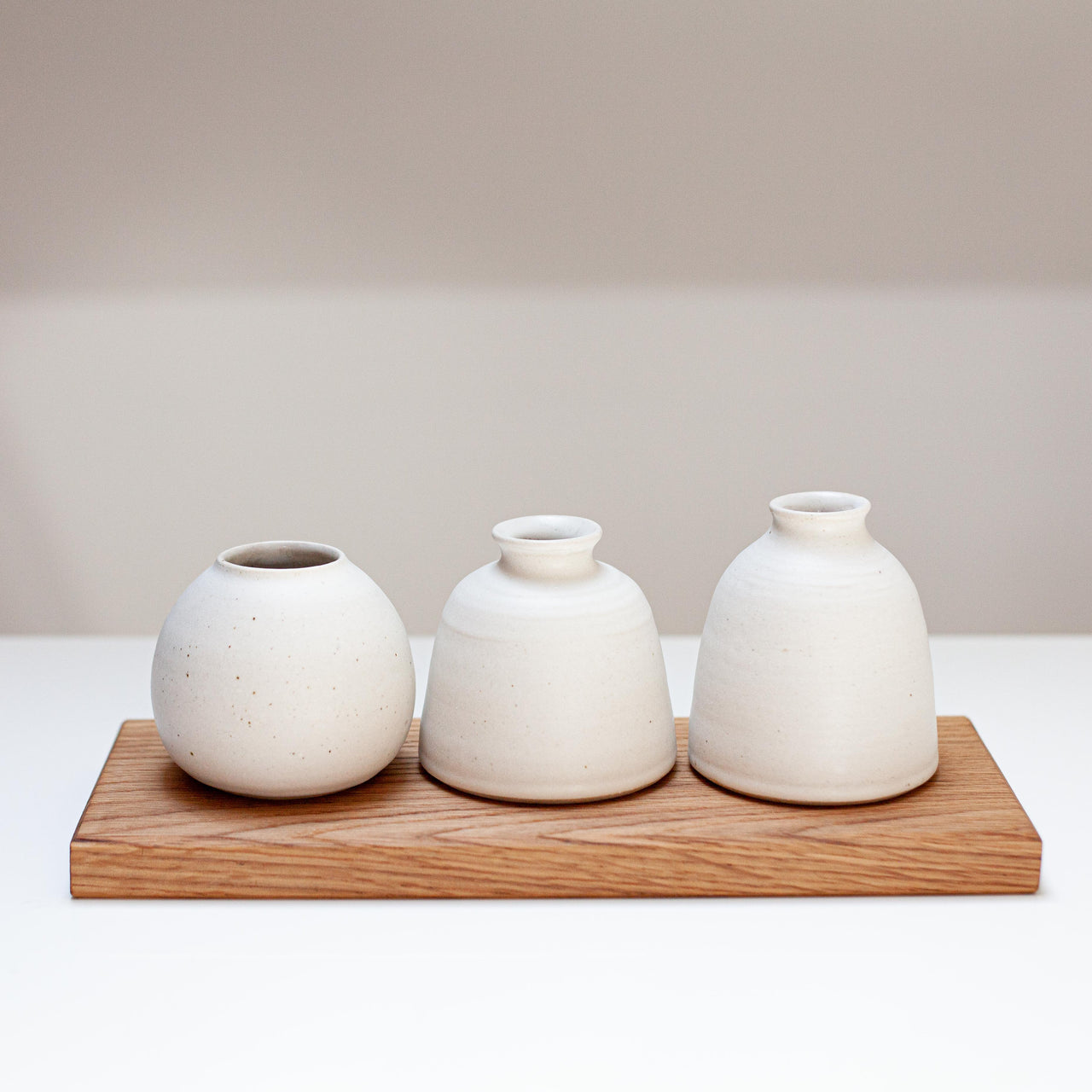 Emily Olivia Tapp wheel thrown bud vases on handmade oak board