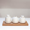 Ceramic bud vase collection by Emily Olivia Tapp (EOT Ceramics) on Oak board
