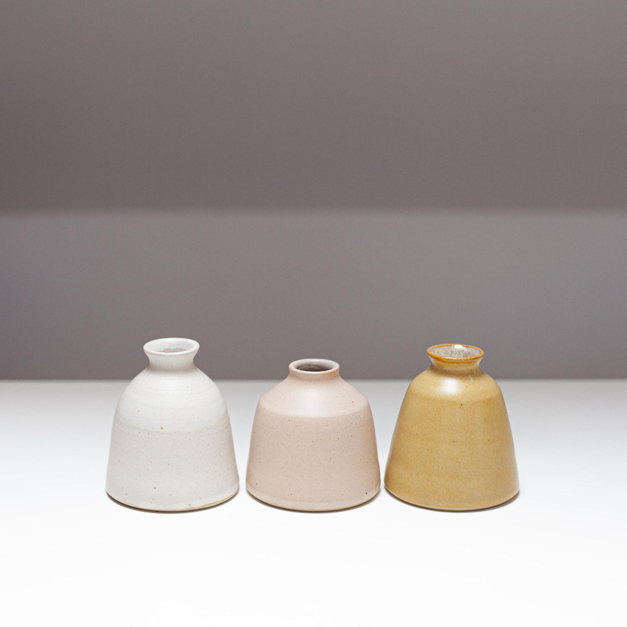 EOT Ceramics bud vase collection in white, pink and yellow