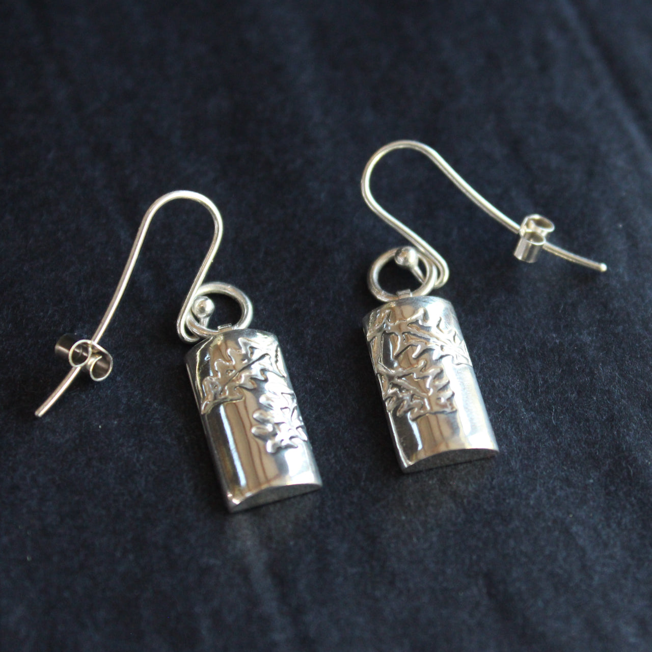 Plantae earrings with embossed holly in silver by Beverly Bartlett