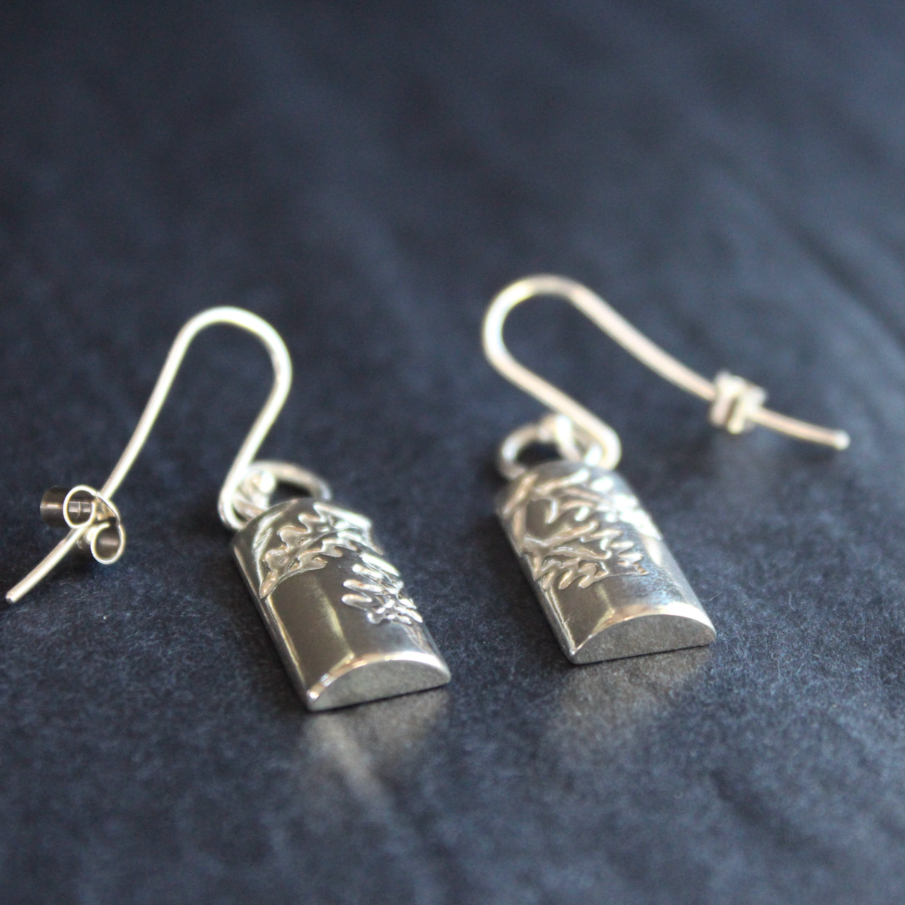 Plantae earrings with embossed holly in silver by Beverly Bartlett