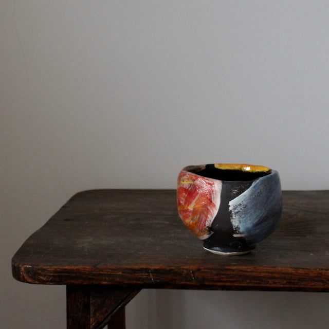 ceramic teabowl in red, blue and yellow by leading UK potter John Pollex