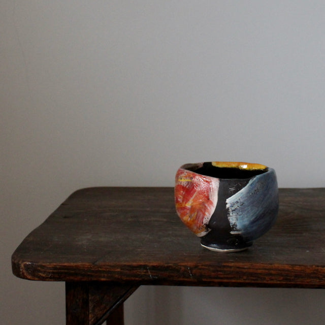 ceramic teabowl in red, blue and yellow by leading UK potter John Pollex 