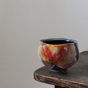 ceramic tea bowl in blues, pinks and reds by John Pollex.