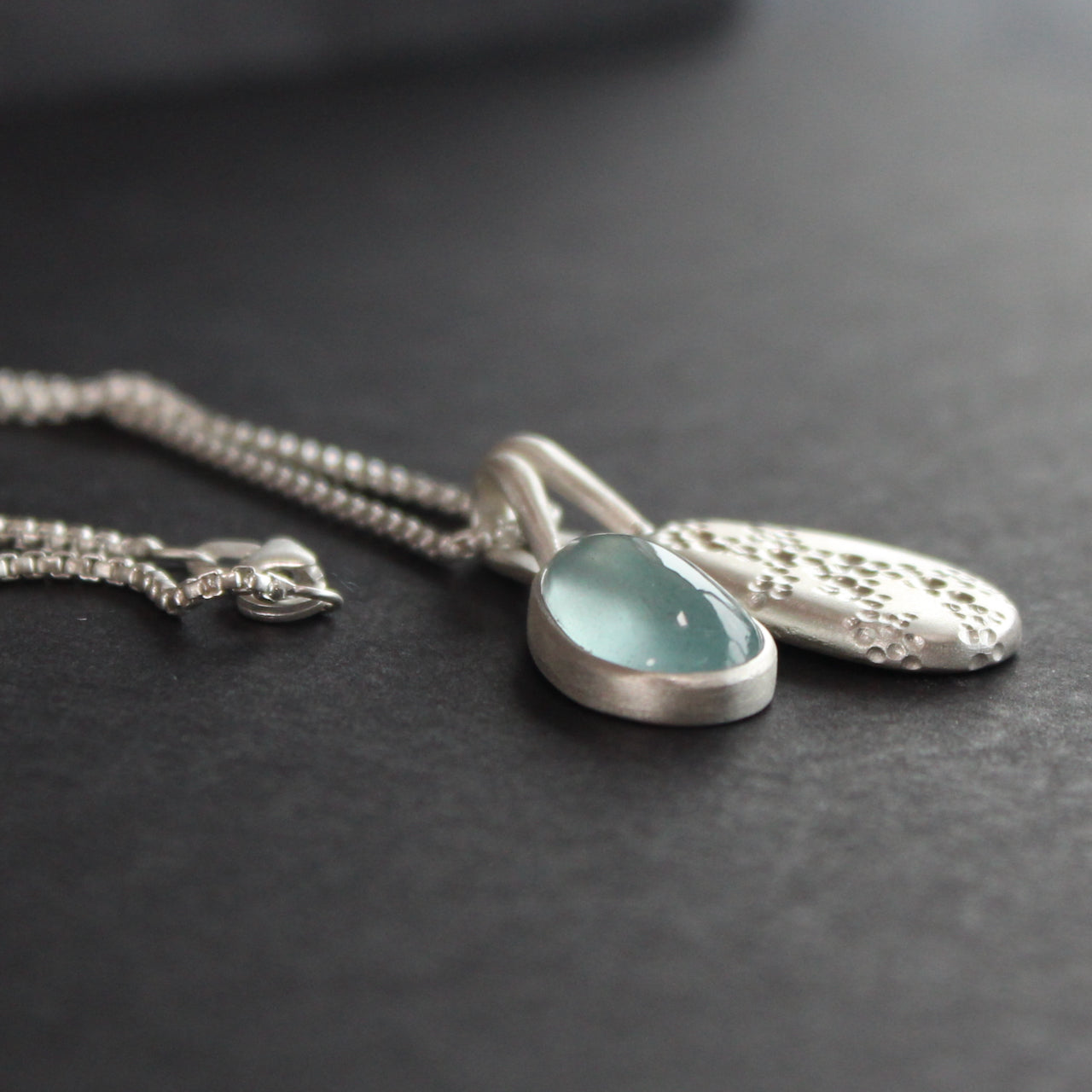 Carin Lindberg - Moss aquamarine and textured silver pebble pendants 