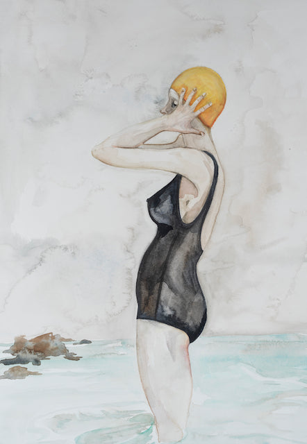 a print of a watercolour painting by Cornwall artist Fiona Chivers of a female swimmer in a black swimsuit and yellow bathing cap standing in the sea