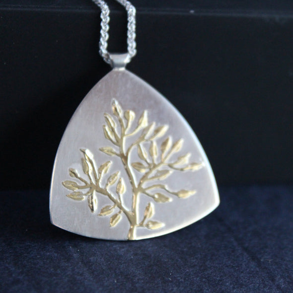 Plantae flat pendant in silver with gold tree detail by Beverly Bartlett